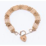 A 9ct rose gold gate bracelet. four bar, length approx 7'', padlock clasp, weight approx 21gms