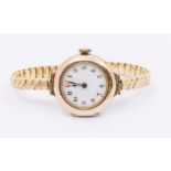 An early 20th Century gold watch with white enamel dial, Arabic numerals, case approx 28mm, on a