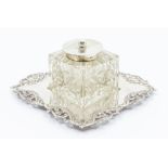 An Edwardian silver mounted glass inkwell incised with floral decoration, plain circular collar