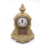 An Italian brass mantel clock with two-train movement striking on two bells. 4" enamel dial. Case