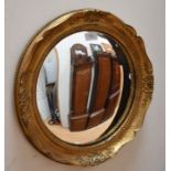 A round gilt hall mirror