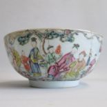 A late 18th century polychrome Chinese bowl decorated with two mandarin scenes and two smaller