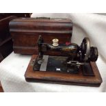 A late 19th/early 20th Century Frister & Rossman German cased table top sewing machine