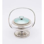 A George V silver, glass and enamel powder bowl and cover, the plain glass ogee shaped bowl with