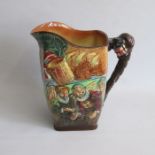 A large Royal Doulton Drake Jug, one side Depicting the Queen and other subjects before the ‘