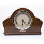 An Elliott Pirelli Ltd presentation mantel clock with three-train movement chiming on rods. Clock