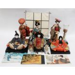A collection of six modern Oriental dolls along with a miniature Chinese schoolmaster in wooden box