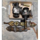 Two early 20th Century carriage/early car lamps, left and right, along with a collection of horse