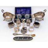 A collection of early 20th silver to include: pair of Edwardian large sauceboats, London, 1908; a