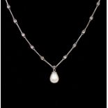 A pearl and diamond set 18k white gold necklace, comprising a pear shaped cultured pearl drop, round