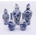 Three Chinese blue and white porcelain graduating baluster vases and covers  together with a pair of