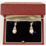 A pair of cultured pearl and diamond set 9ct white gold drop earrings, comprising a round