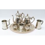 A collection of silver plated items including tea set, trays and tankards