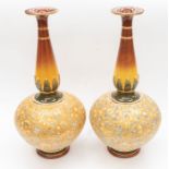 Royal Doulton; a large pair of vases, decorated in lace pattern