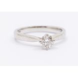 A diamond and platinum solitaire ring, four claw set round brilliant cut of approx 0.58ct,