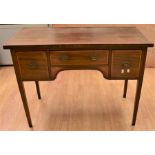 An Edwardian mahogany sideboard having boxwood banding and inlaid detail, on tapered legs