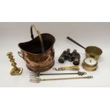 A collection of brass and copper wares including coal scuttle, bedpan, candlestick, fire irons,