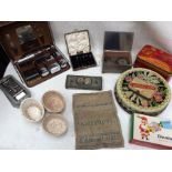 A collection of vintage tins, sampler from the 19th Century, vanity sets, razor, 19th Century