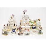 A large collection of mostly mid 19th century Staffordshire figures inc Jokey and racing horse,
