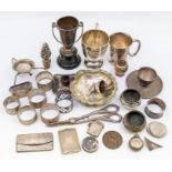 A collection of early 20th Century silver to include: two Christening mugs - one ovoid, one baluster