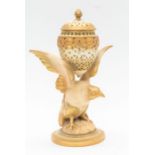A Royal Worcester lidded pot pourri carried by a bird of prey. Condition: hairline crack to the