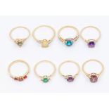 A collection of 9ct gold and gem set rings to include amethyst, pink zircon, ruby, topaz, neo