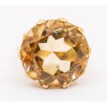 A citrine and 9ct gold dress ring, comprising a round mixed cut citrine claw set coronet mount, size