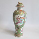 A mid-19th century Cantonese export porcelain vase and cover with dog finial, decorated with 4