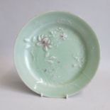 An early 20th century Chinese Celadon decorative plate with raised moulded flowers. Date: Early 20th