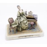 An Italian porcelain large figural group modelled as an 18th Century Lady beside harpsicord, with