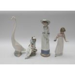 Four Nao figures of two young ladies a clown boy and swan