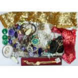 A collection of costume jewellery including a silver hinged bangle, paste set brooches, bead