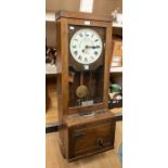 An early 20th Century Gledhill Brook time recorder/clocking in machine, oak cased, number 14670/