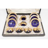 A set of six early 20th Century Continental probably East European cobalt blue glass and gilt shaped