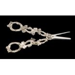 A 19th Century style silver grape scissors, the handle cast as trailing foliage, hallmarked, 3.69