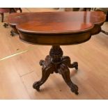 Early Victorian rose mahogany card table on four scrolled legs with castors