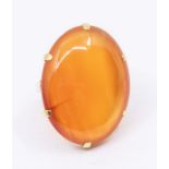 A large carnelian and 18ct gold dress ring, oval claw set stone approx 20 x 28mm, size K, total