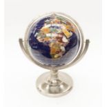Small modern globe, Countries made up from marble and crystal on a stainless steel base