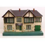 Triang: A Tri-ang wooden dolls house, no contents. Some parts in need of restoration. Measuring