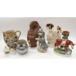 A collection of 19th Century Staffordshire figures, water jugs including a Barge ware teapot
