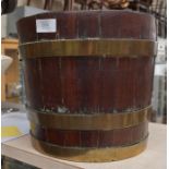 An 18th Century peat bucket with brass strapping, bands loose