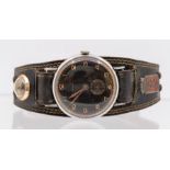 A vintage gents Regalis rose plated wristwatch, round black dial with rose metal Arabic numbers,