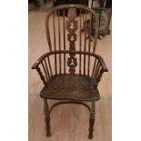 A 19th Century oak and elm country kitchen spindle back armchair with U stretcher