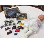 A collection of Burago Oxford and Corgi boxed cars and vehicles, along with 1940's doll with