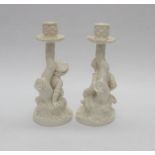 A pair of Royal Worcester Hadley candlesticks of a boy and girl. Condition: good. Total height 9