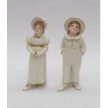 A pair of Royal Worcester Hadley sugar sifters in the form of a boy and girl. Condition: Girl has