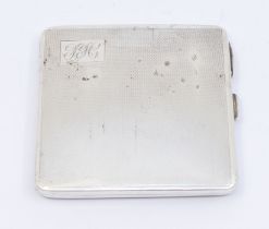 A George VI silver engine turned cigarette case, engraved with initials, hallmarked by W Neale,
