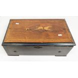 A 19th Century Swiss musical box; jockey and horse inlay to mahogany top, 52 x 30cms approx; eight