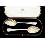 A pair of late Victorian silver berry spoons, hallmarked by Walker & Hall, Sheffield, 1897, approx