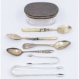 A collection of early 20th Century silver to include: silver mountd shaped oval glass toilet bottle;